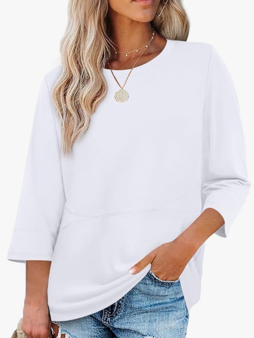 Soft white top with a relaxed silhouette. Features a crew neckline and 3/4 sleev